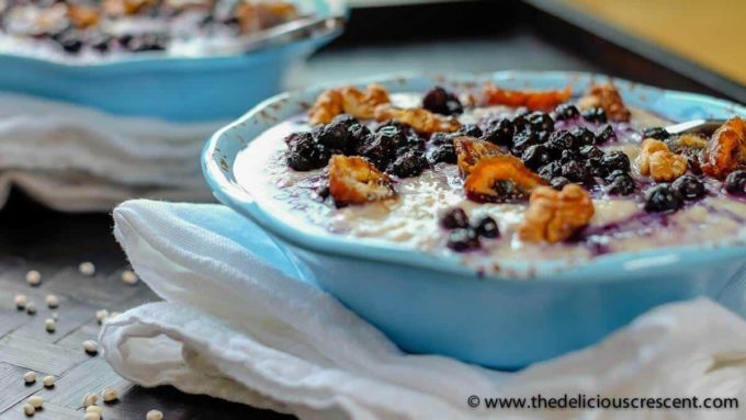 Side view of porridge with blueberries.