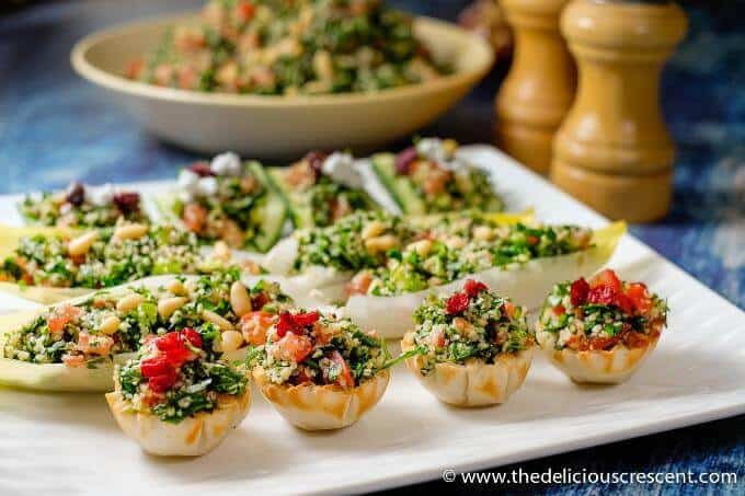 Tabbouleh salad served in mini filo cups and lettuce boats.