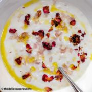 Mast O Musir, a Persian yogurt dip with shallots served in a bowl.