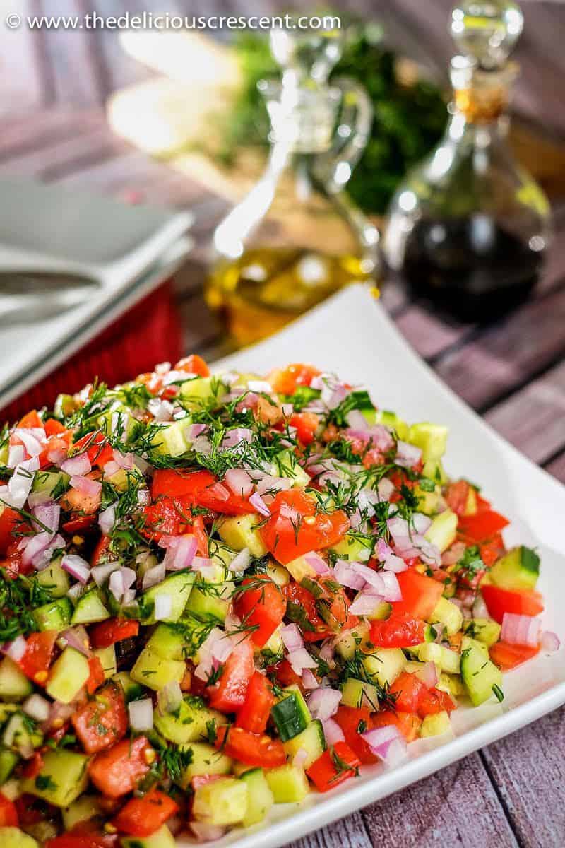 A view of Persian salad piled on a plate.