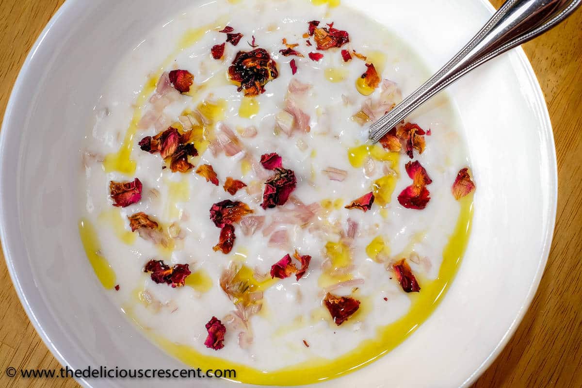 Close up view of Persian yogurt dip with shallots served in a bowl