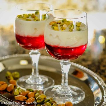 Rice custard with pomegranate jelly in a serving cup.