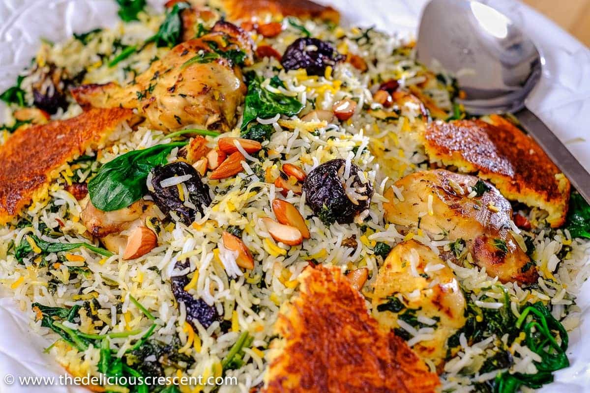 Saffron Yogurt Rice with Spinach and Prunes, a classic Persian dish referred to as Tahchin e Esfanaj.