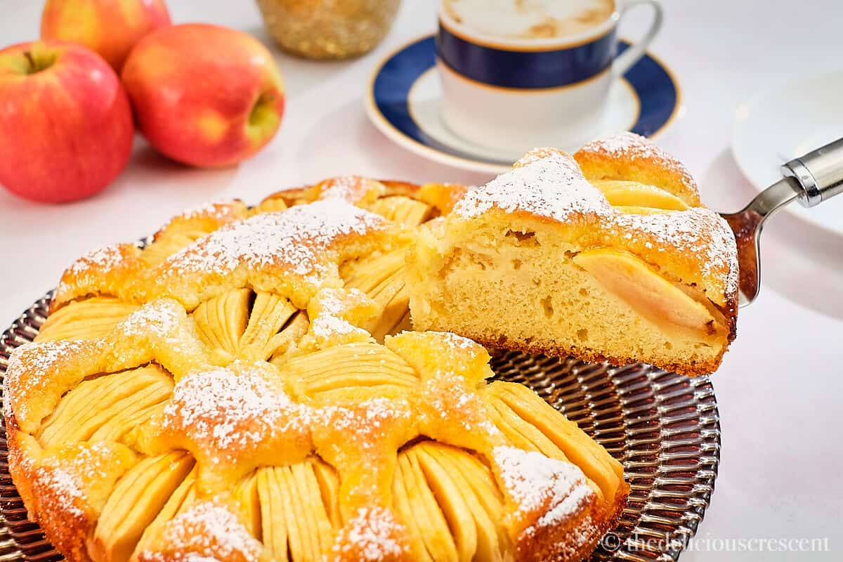 A slice of the cake being lifted with a serving utensil.