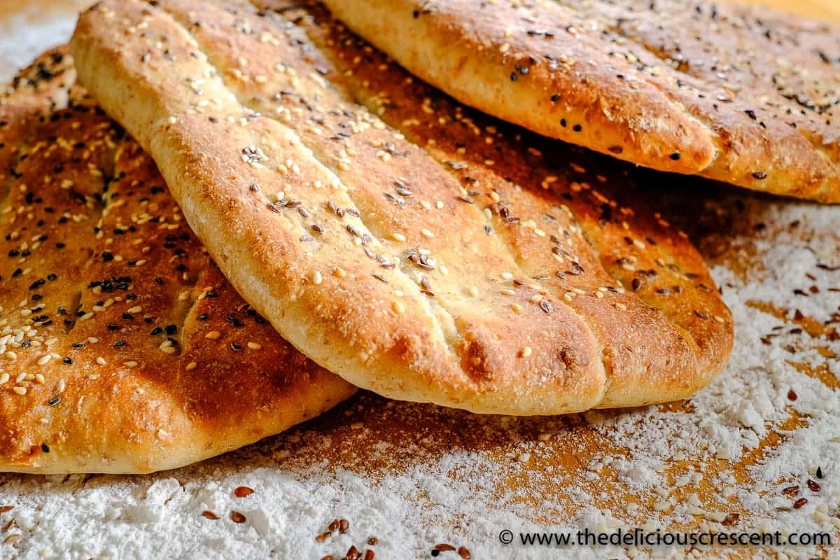 Persian flat breads with flour dusted around.