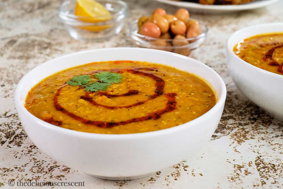Mediterranean red lentil soup served on the table.