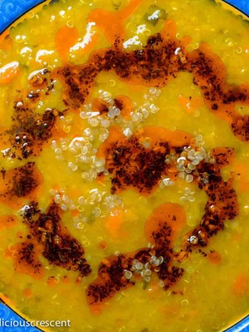 Mediterranean red lentil soup served in a plate.
