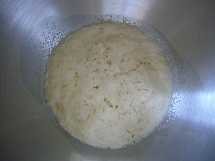 Dry yeast foamed up in a bowl.