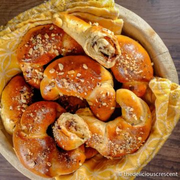 Chocolate hazelnut crescent rolls served in a basket.