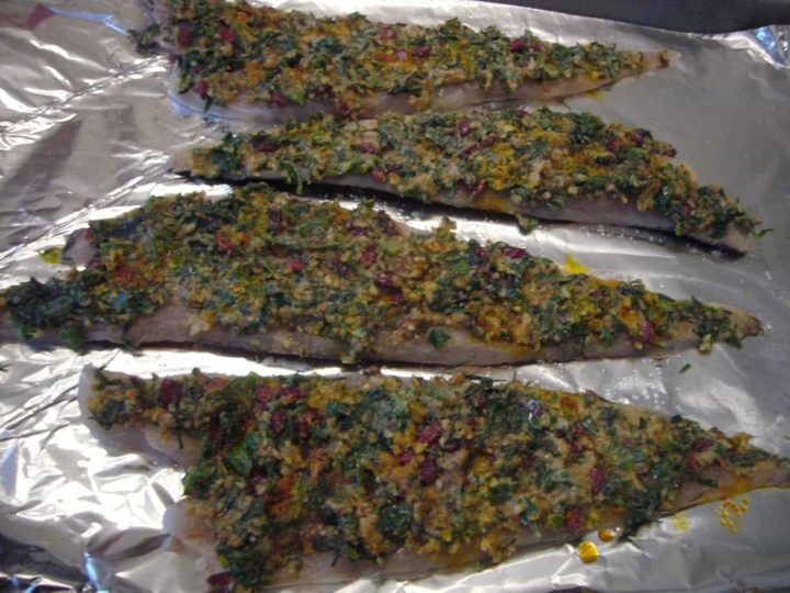 Almond and herb mixture spread on the fish for making the baked fish.