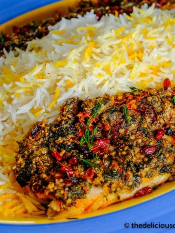 Almond crusted baked fish served with rice.
