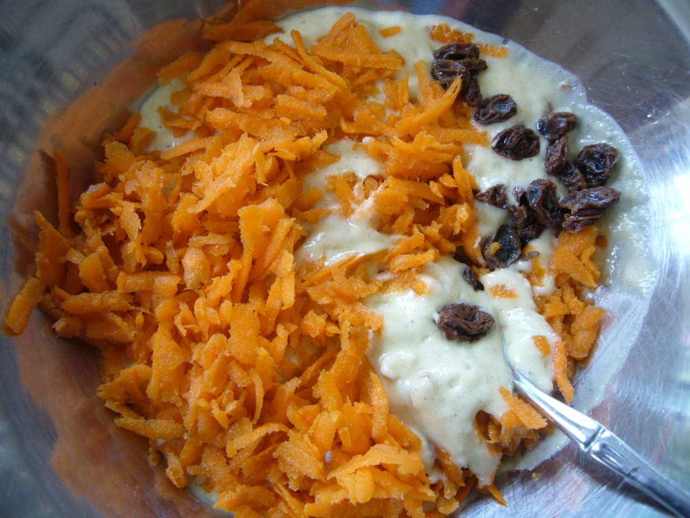 Addition of grated carrots and raisins to the batter.