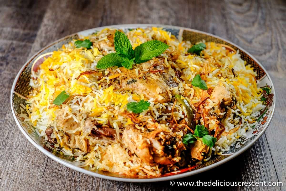 Indian rice and chicken dish in a round plate.