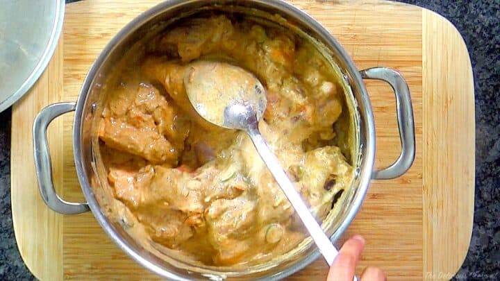 Chicken combined with marinade ingredients.