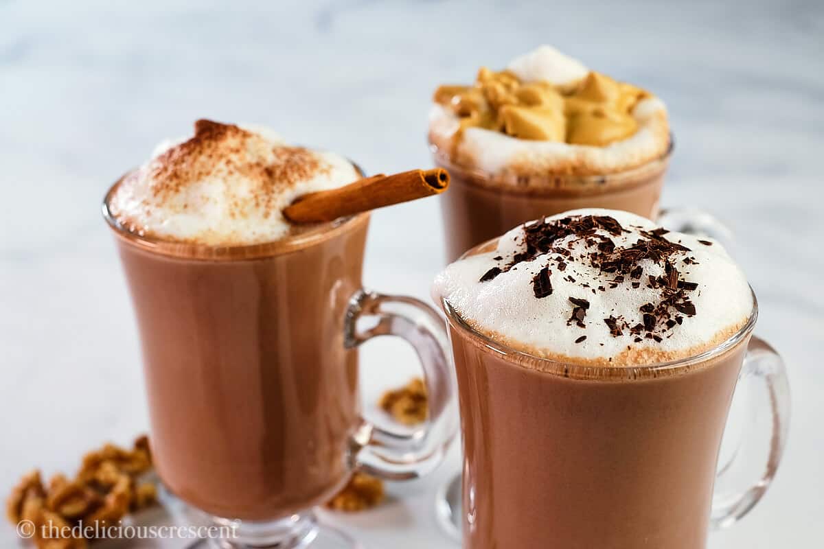 Steaming cocoa in glass mugs.