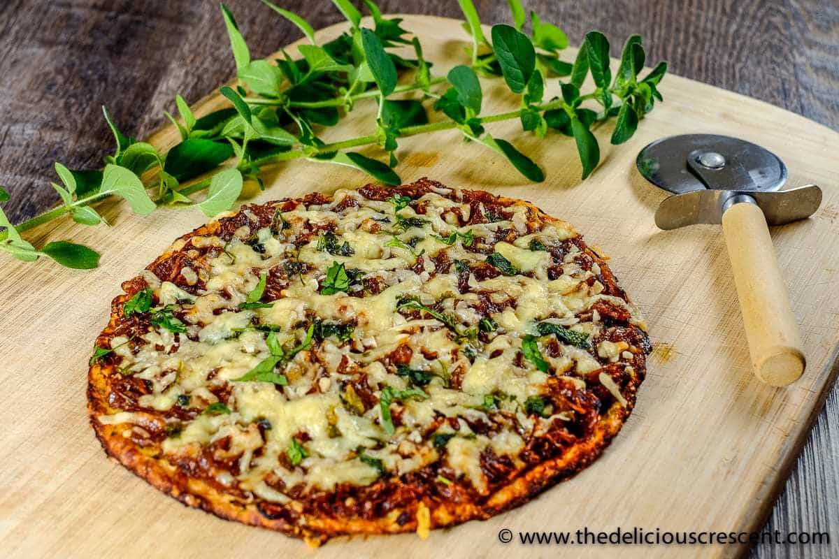 Low carb pizza with a pizza slicer