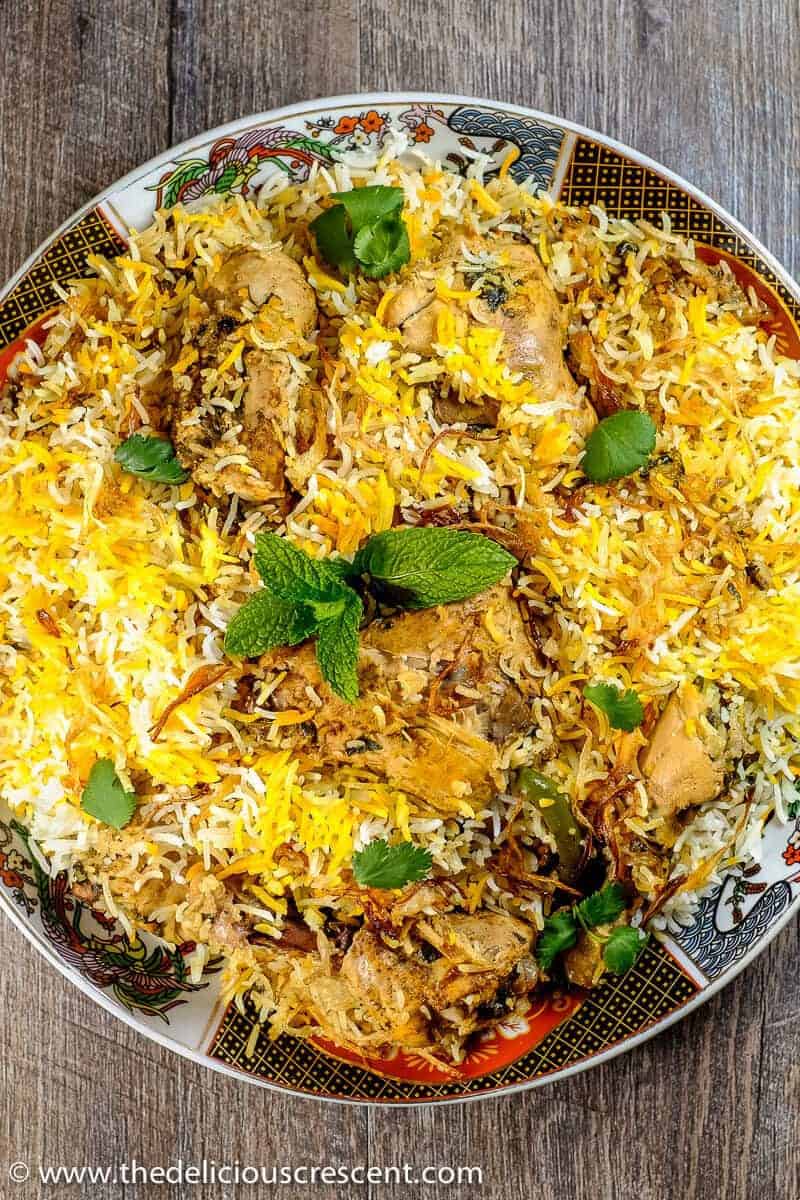 Overhead view of delicious Hyderabadi biryani served in a plate.