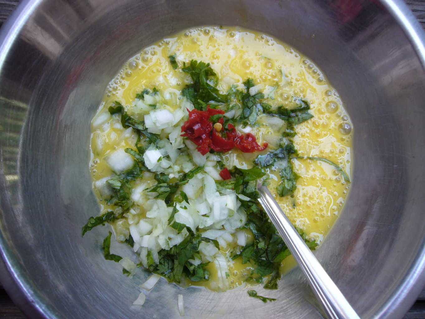 Omelette ingredients for making the egg paratha.