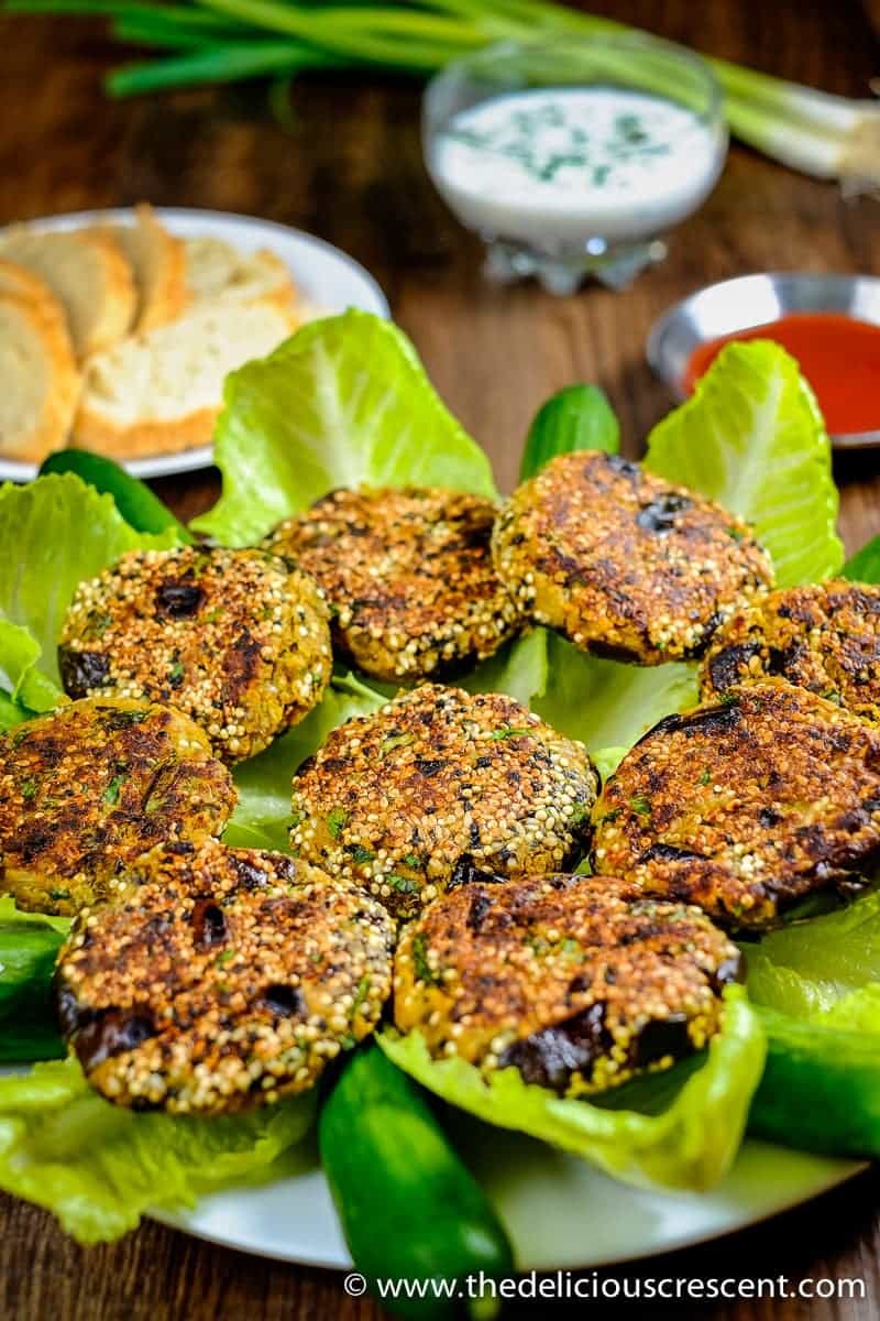 Eggplant patties served over lettuce and placed on the table.