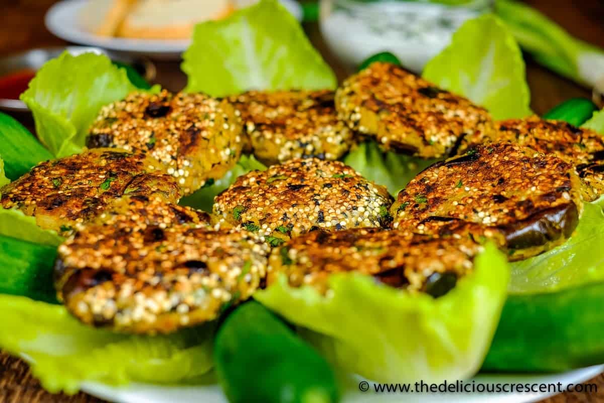 Close view of chickpea patties made with eggplant and spices.