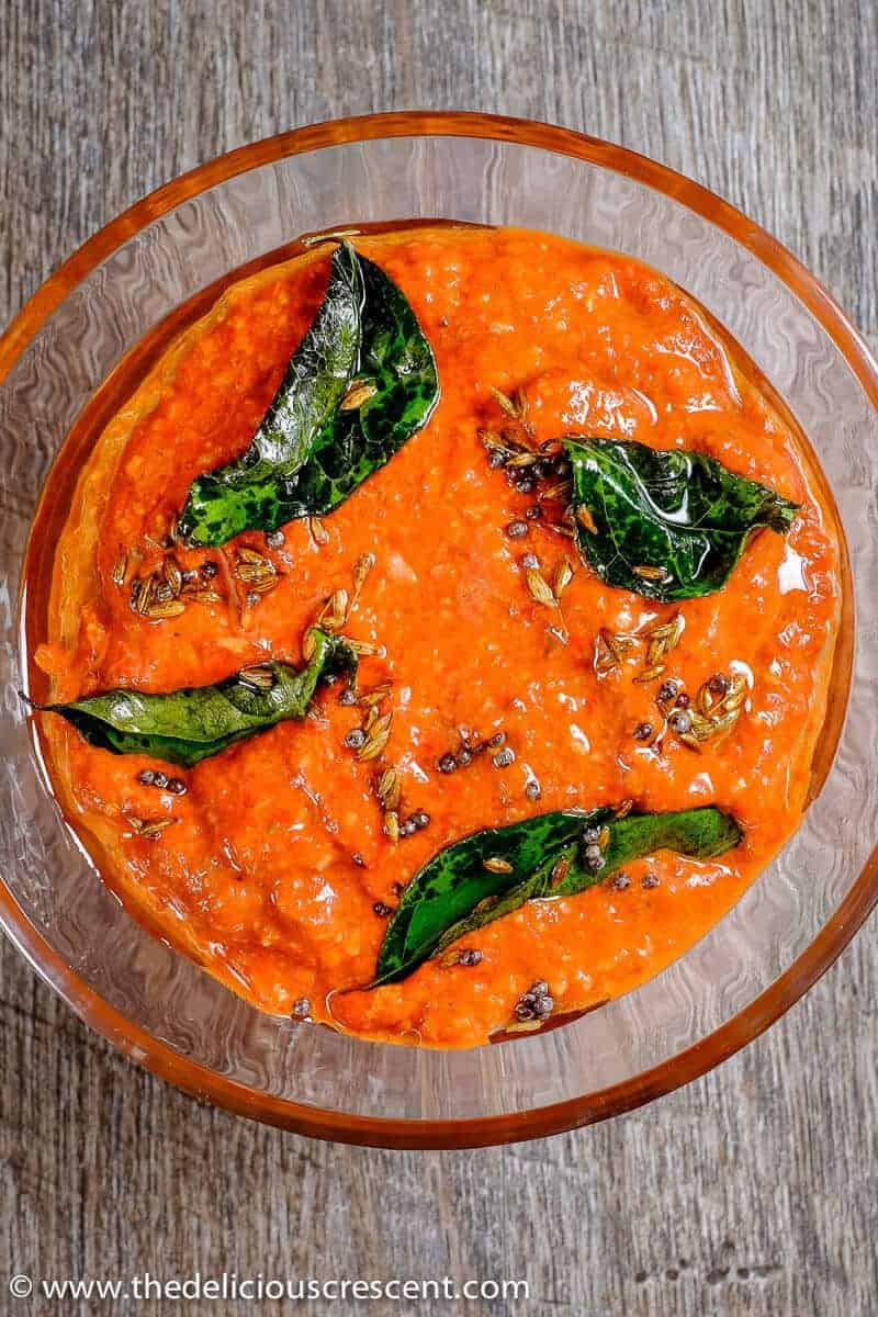 Indian red pepper chutney in a glass bowl.