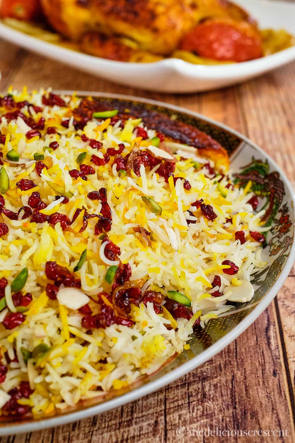 Barberry rice with saffron chicken on the table.