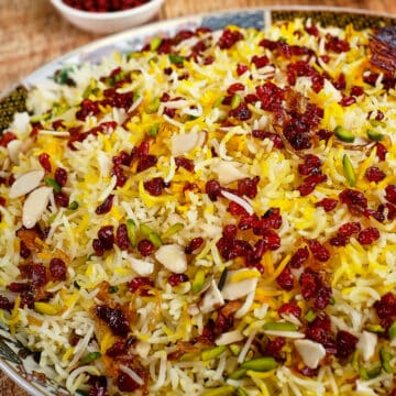 Close view of Persian barberry rice served with saffron chicken.