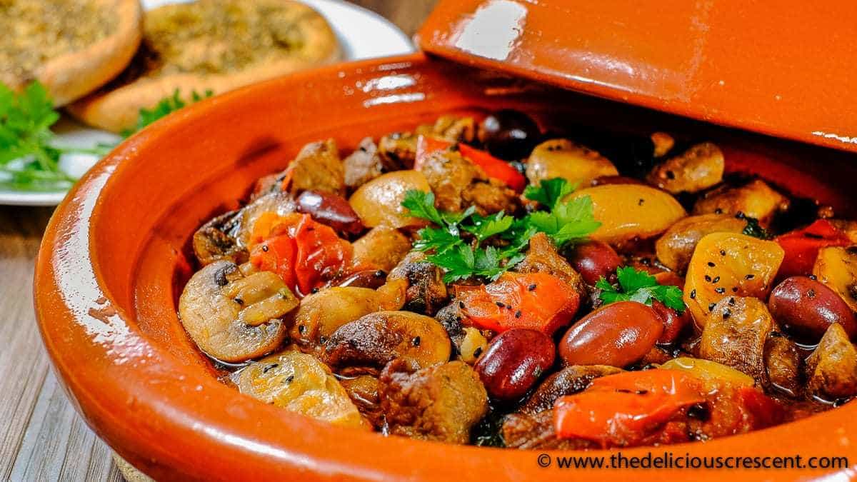 Lemony Lamb Tagine with Mushrooms and Olives is a Moroccan style dish with succulent earthenware stewed lamb loaded with healthy deliciousness – rich in flavor, high protein and potassium, low carb and calories, healthy fats, good fiber!!