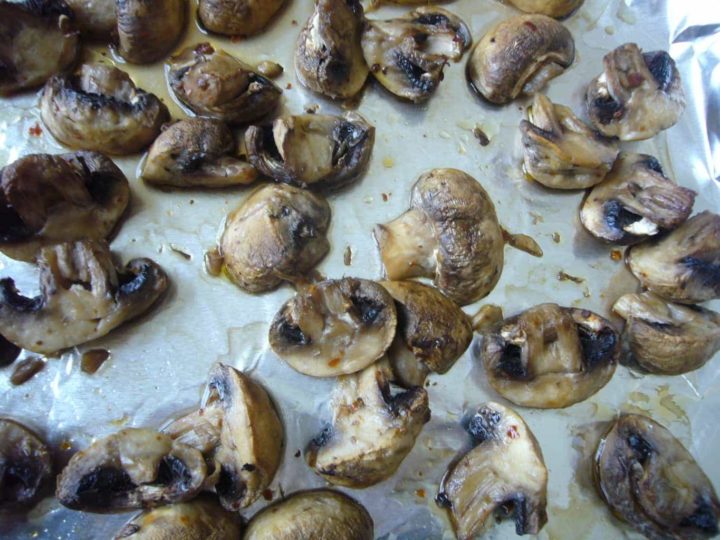 Roasted mushrooms on a baking sheet.
