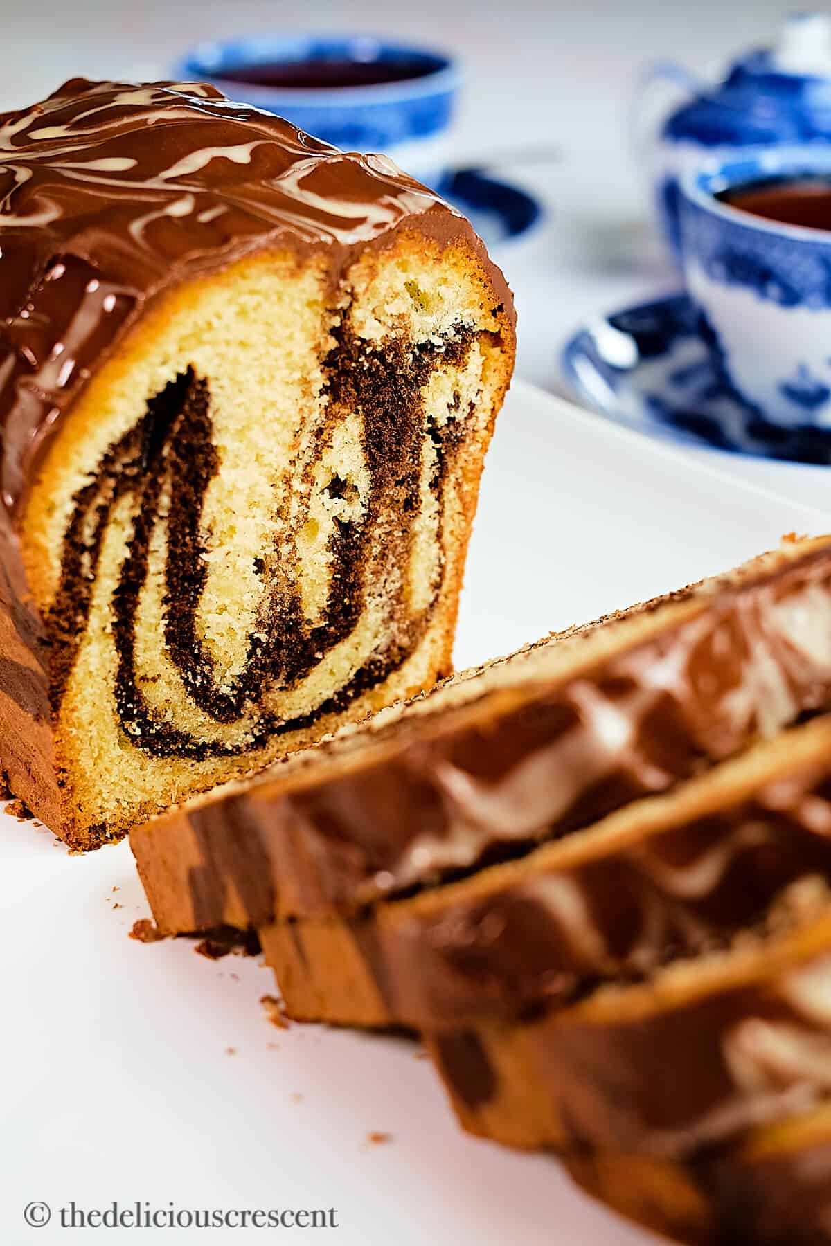 A loaf of tahini marble cake sliced.