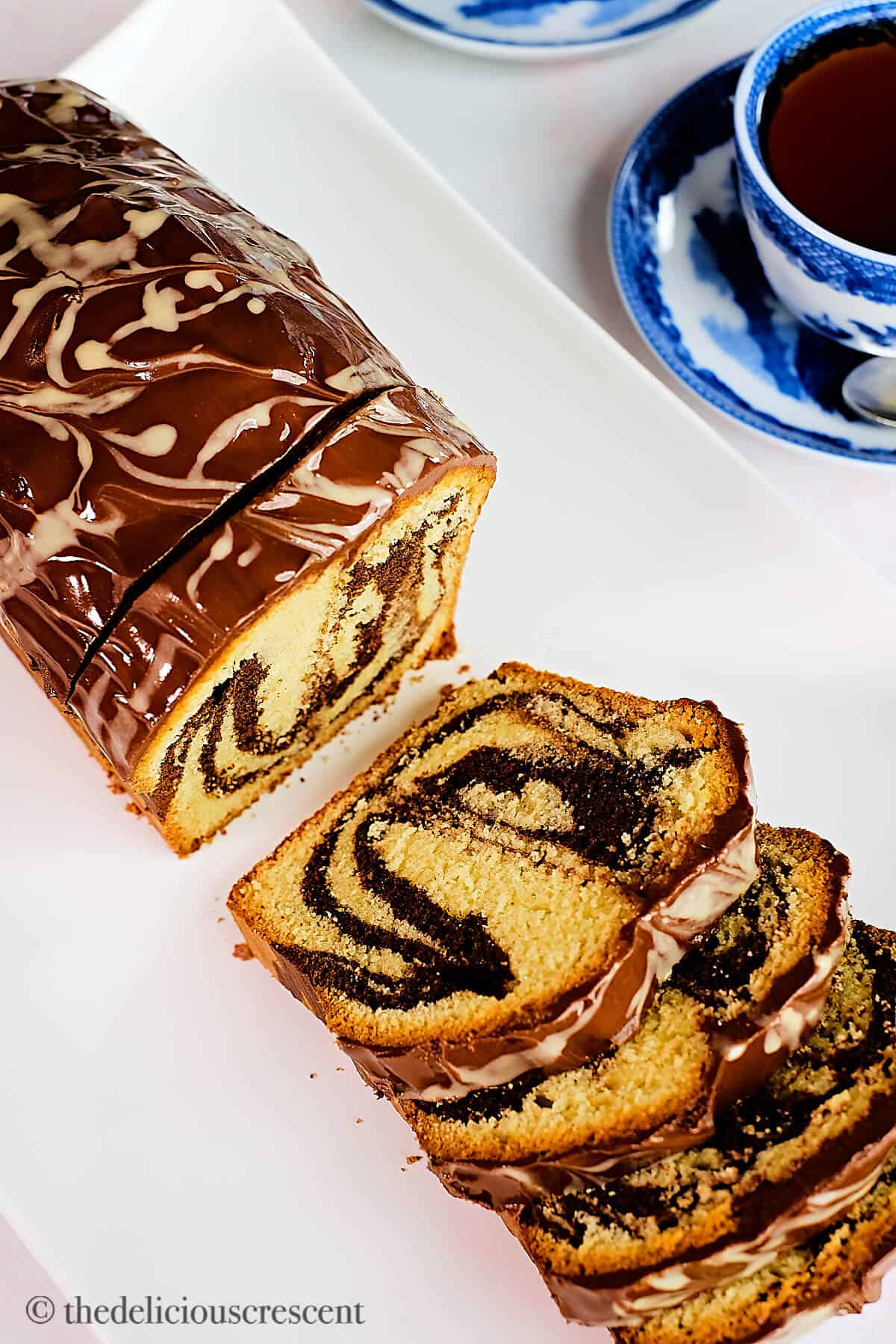 Overhead view of a loaf cake made with tahini and chocolate.