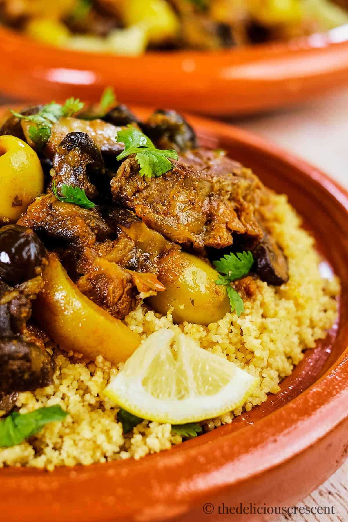 Lamb stew served over couscous in a tagine.
