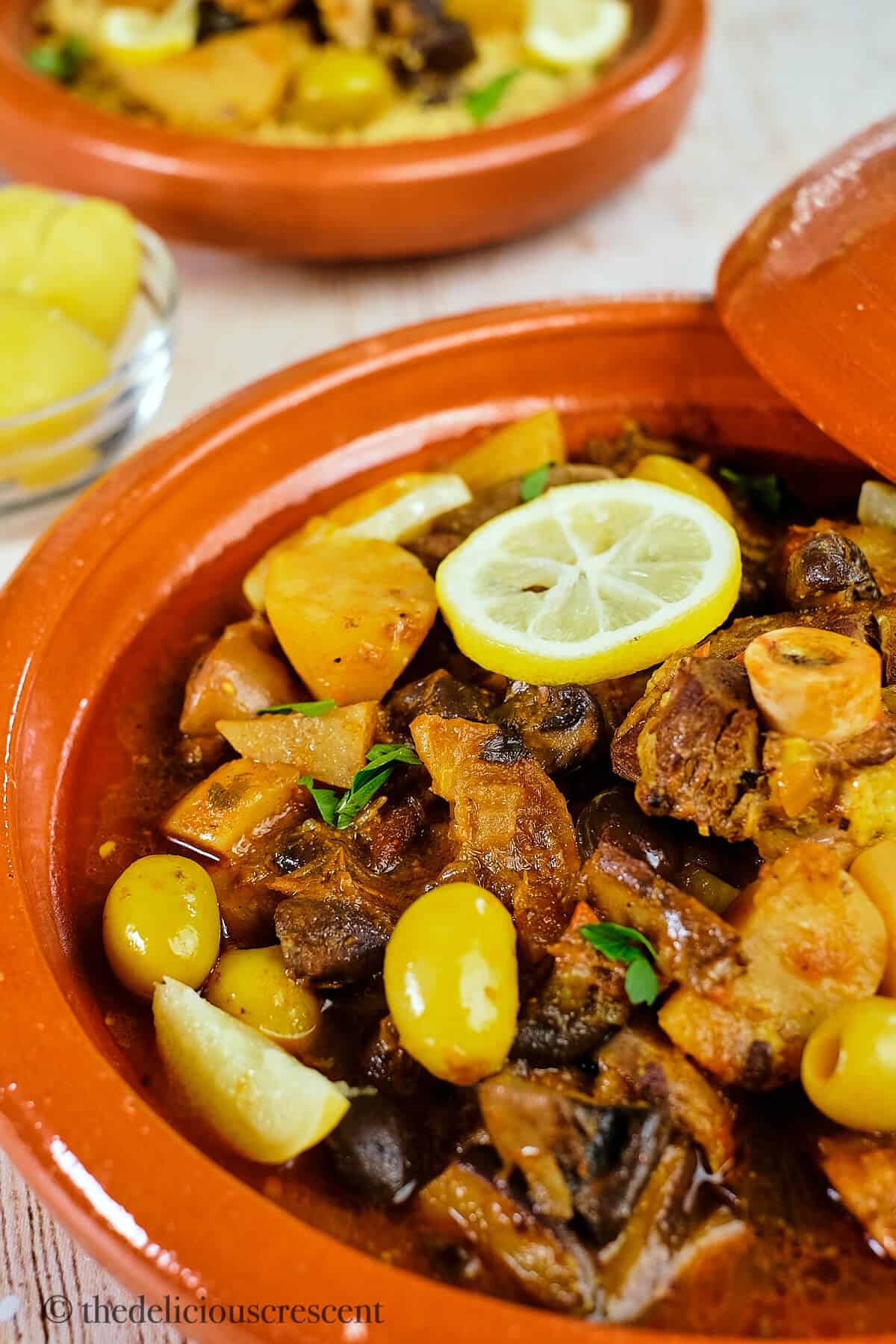 Moroccan lamb tagine with olives served in eartherware.