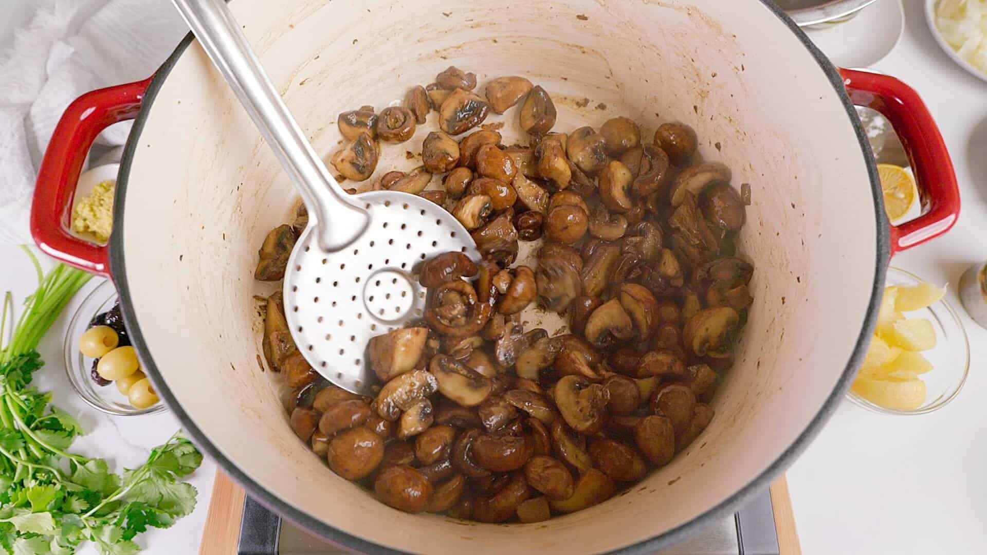 Sauteing mushrooms for the stew.