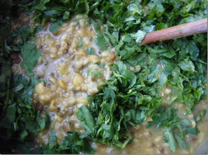 Herbs added to chicken rice porridge.