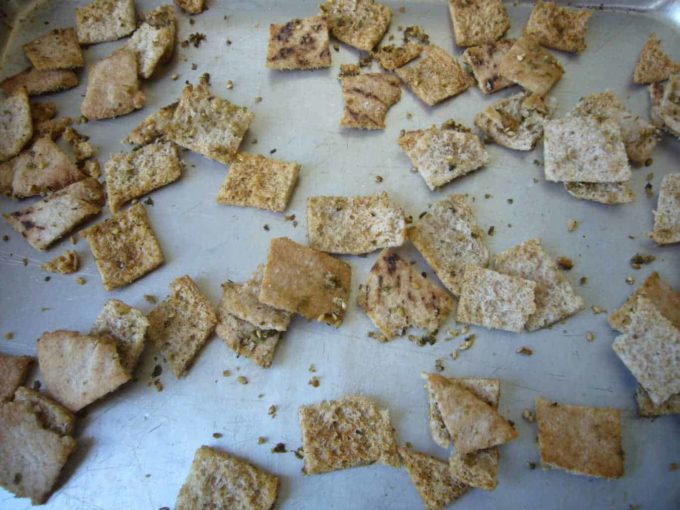 Pita chips on a baking sheet.