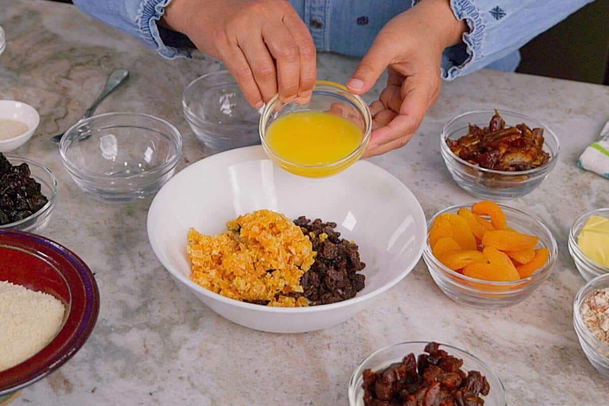 Soaking the dried fruit with orange juice.