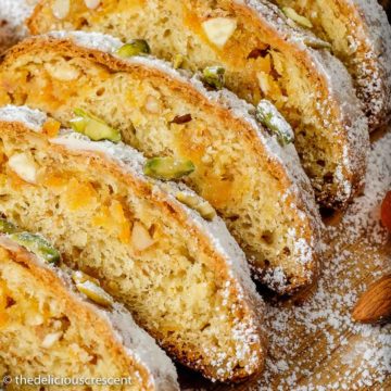 Apricot almond marzipan stollen slices served on a plate.