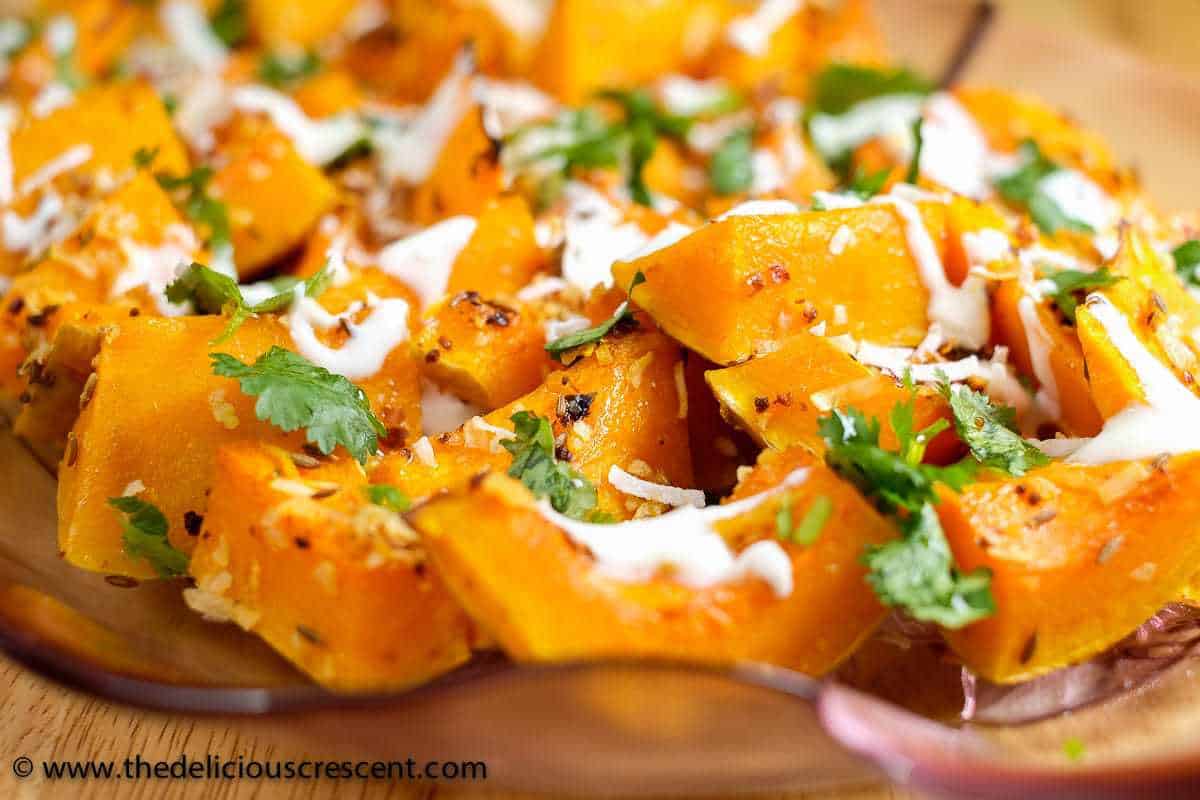 Squash roasted with spices and topped with herbs and a creamy sauce.