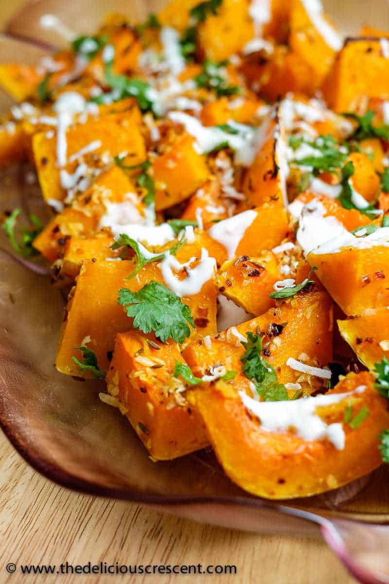 Spicy butternut squash roasted and drizzled with a yogurt sauce.