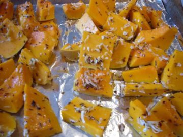 Butternut squash tossed with coconut flakes, spices and oil.