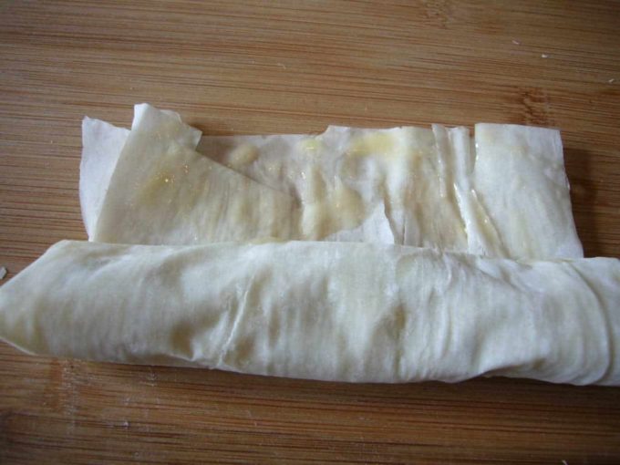 Phyllo sheet rolled over around the potato filling.