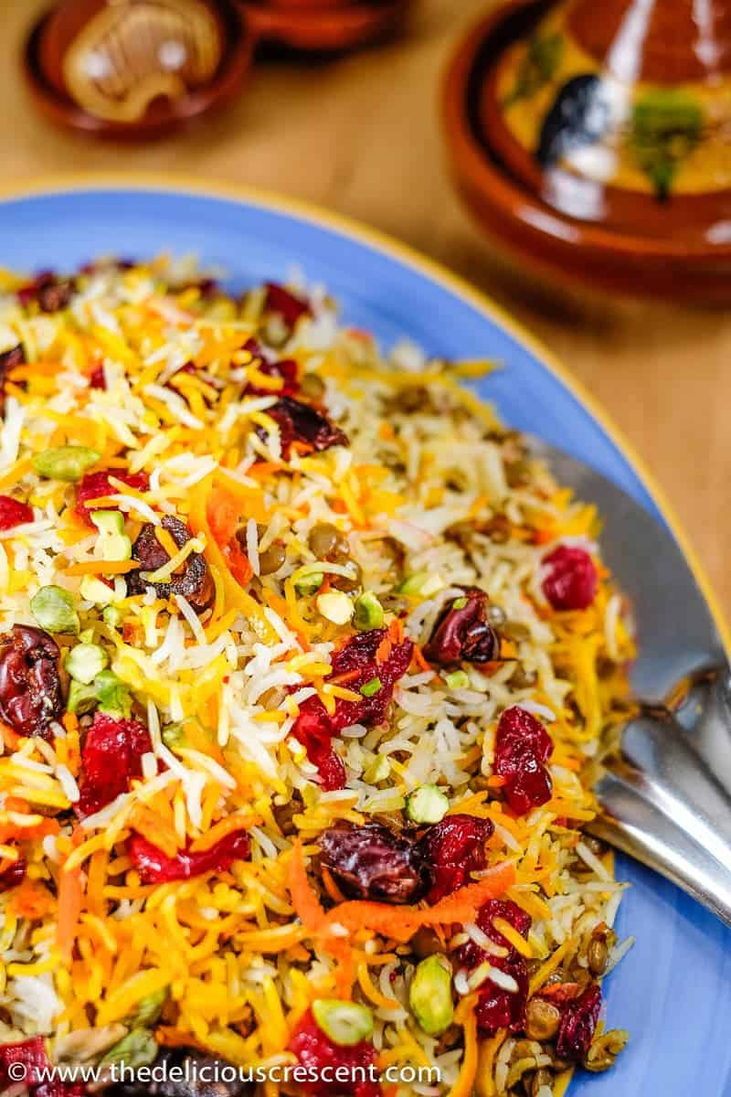 Lentils and rice with cranberries served on a plate.