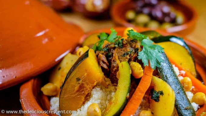 Close view of a lamb and vegetable tagine served on the table.