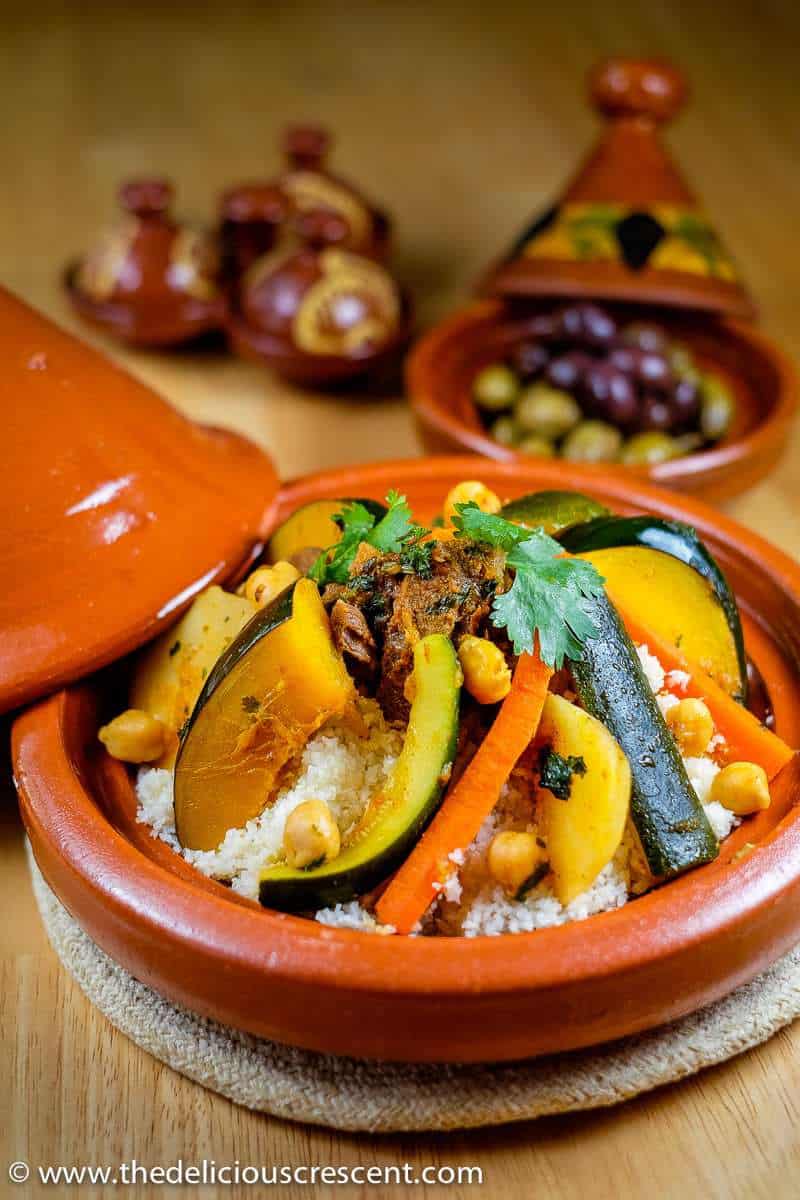 Moroccan stew with vegetables and lamb served in a traditional tagine.