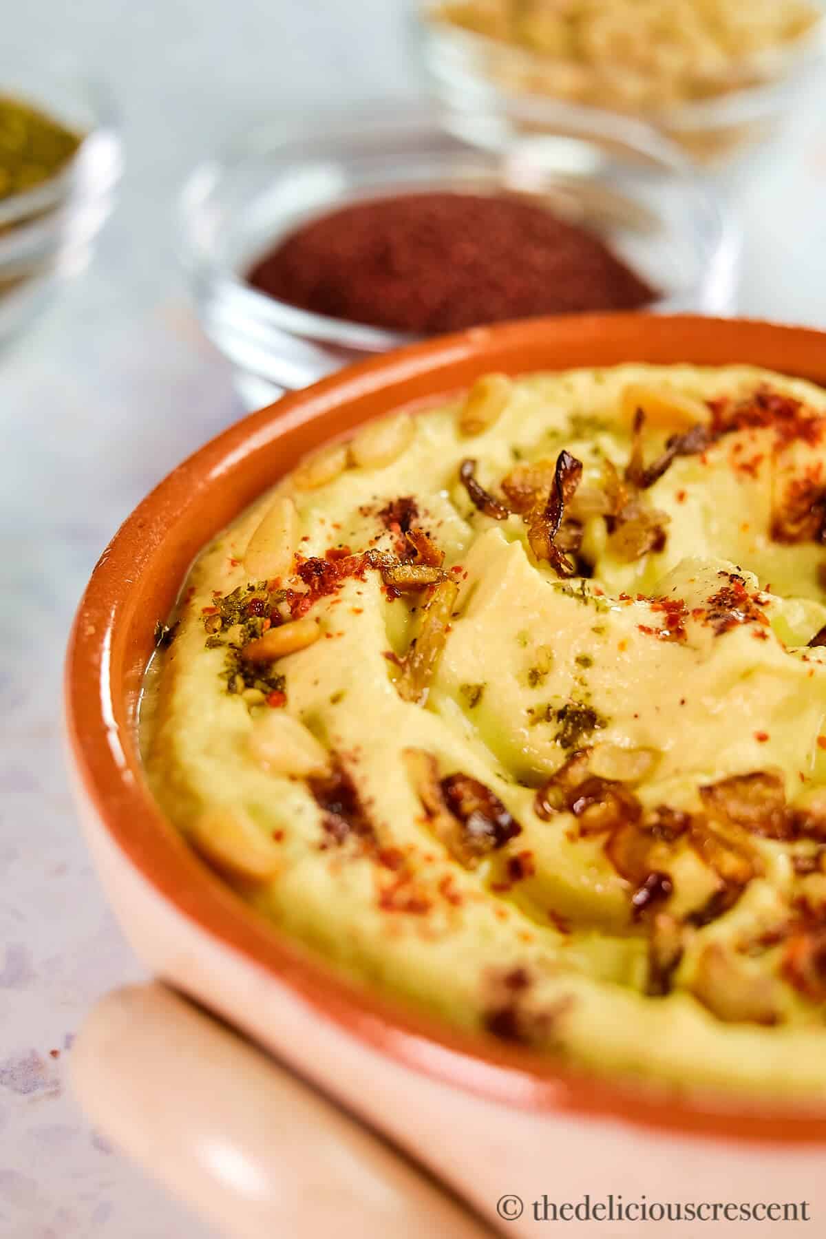 A bowl full of creamy yellow squash puree.