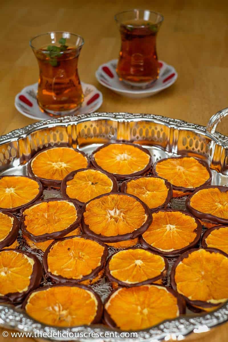 Dark chocolate orange slice wheels are a delicious tangy-sweet treat with decadence in every bite. This orange slice candy can make a great gift for the holidays. Learn how to make this easy recipe for these healthy snacks using orange slices dried at home. A quick treat with dried fruit and minimal added sugar. #lowcarb #sweets Dark Chocolate Orange Slice Wheels are an elegant treat with decadence in every bite. So easy, healthy and delicious tangy-sweet treat!