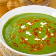 Creamy low carb spinach and mustard greens soup served in a bowl.