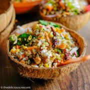 Sprouts salad served in a coconut shell.