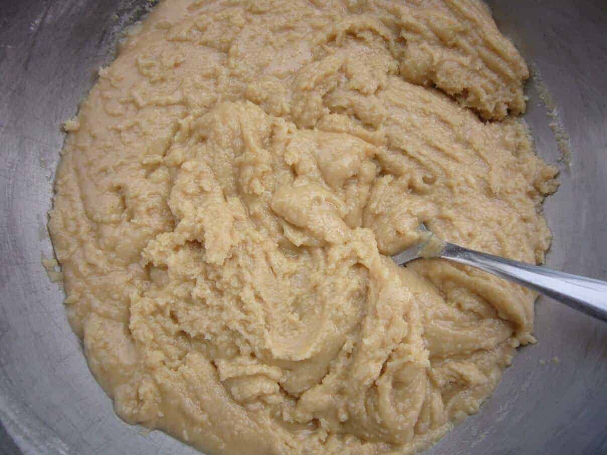 Date filled cookies preparation. Dough prepared by mixing ghee, sugar and flour.